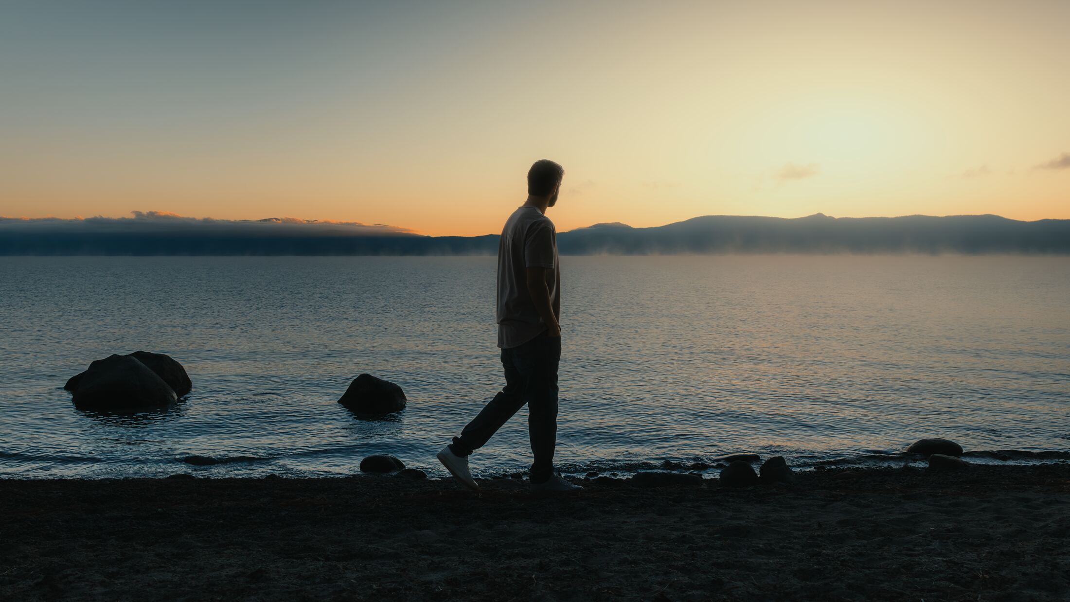 MKE walking the shoreline of Lake Tahoe at sunset