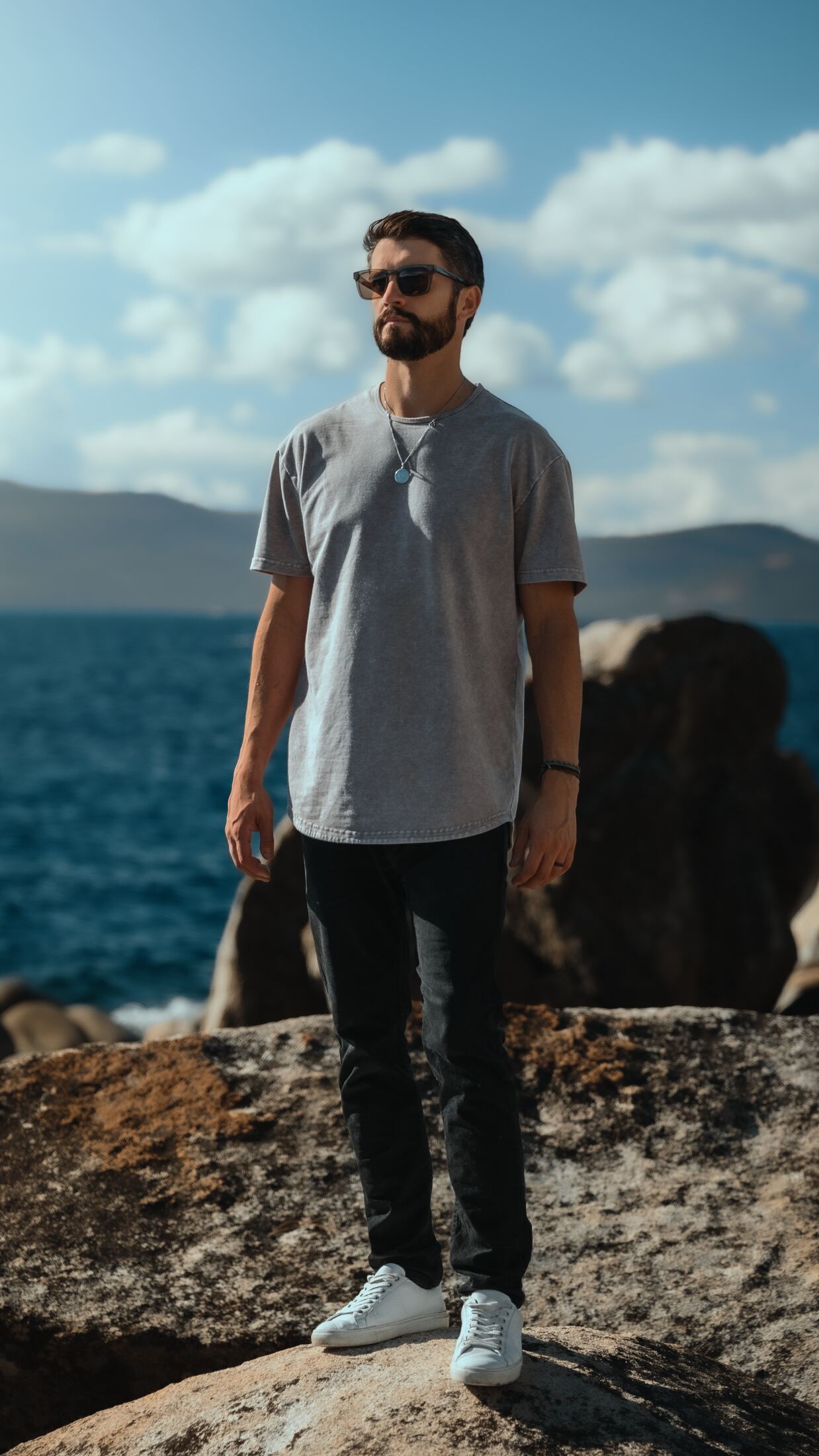 MKE standing on a granite boulder above the lake